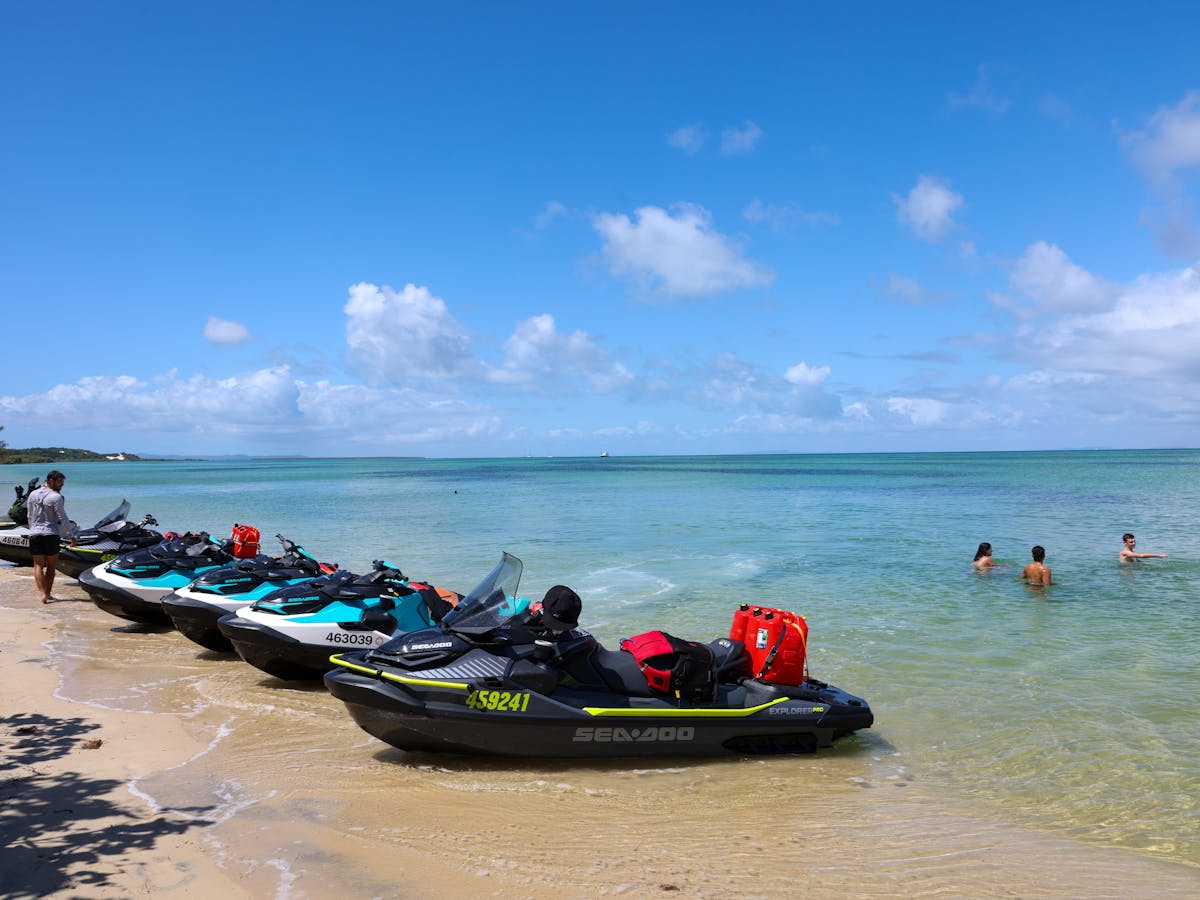 Fleet of Sea-Doo jetskis on beach